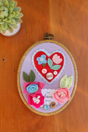 "let love grow" original embroidered wall art with handmade felt flowers and heart