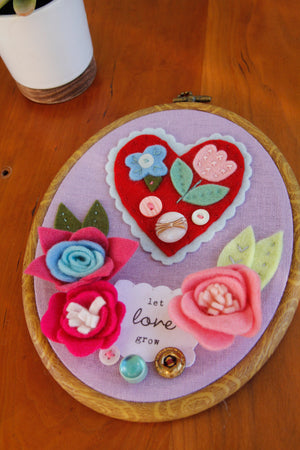 "let love grow" original embroidered wall art with handmade felt flowers and heart