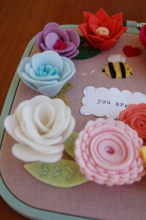 you are loved" original embroidered wall art with handmade felt flowers and bee